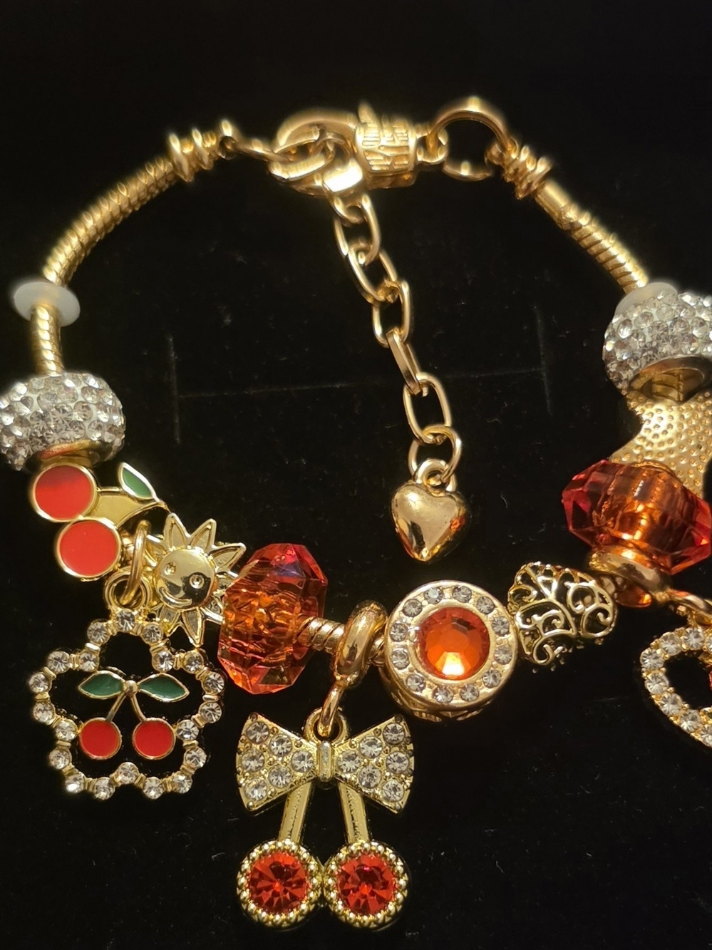 Gold-Tone Red Crystal Charm Bracelet with Cherry and Bow Charms
